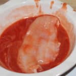 catfish soaking in hot sauce