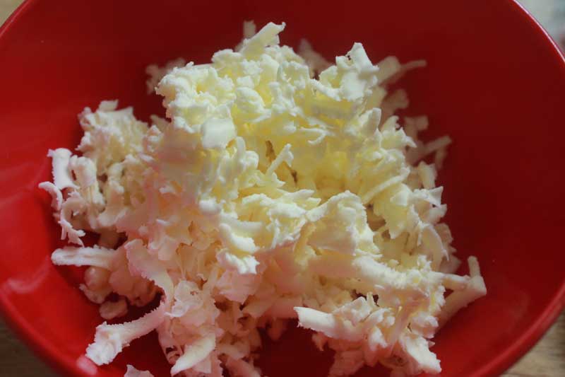 grated butter in bowl