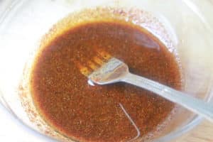 soy sauce and other ingredients in bowl with fork