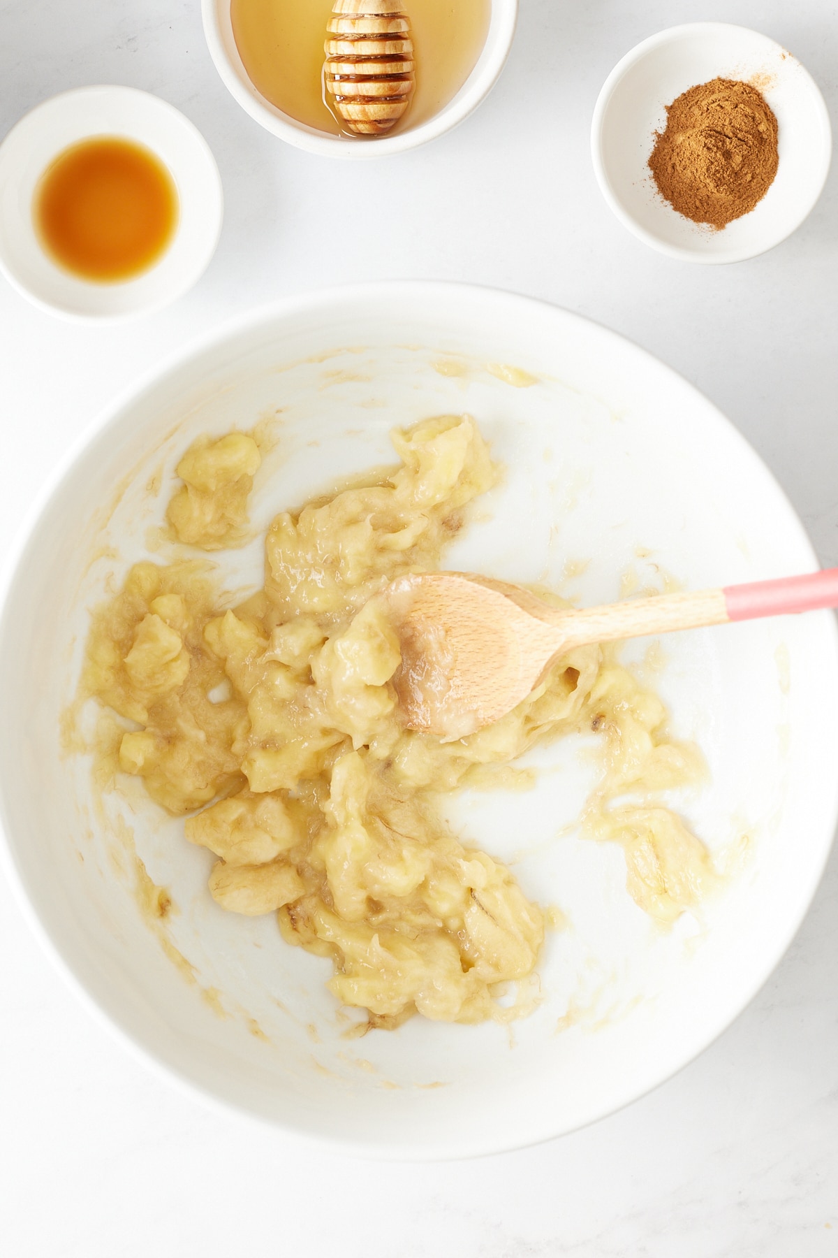 banana being mashed in a bowl