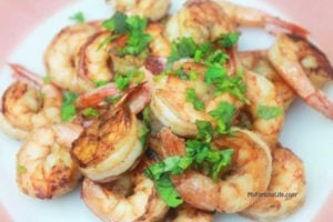 shrimp on plate with cilantro on top