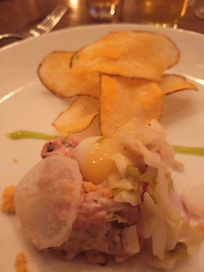 veal tartare quail egg cheddar chips on plate