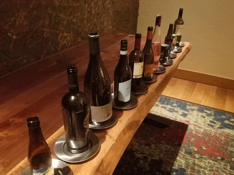 wine bottles lined up on table