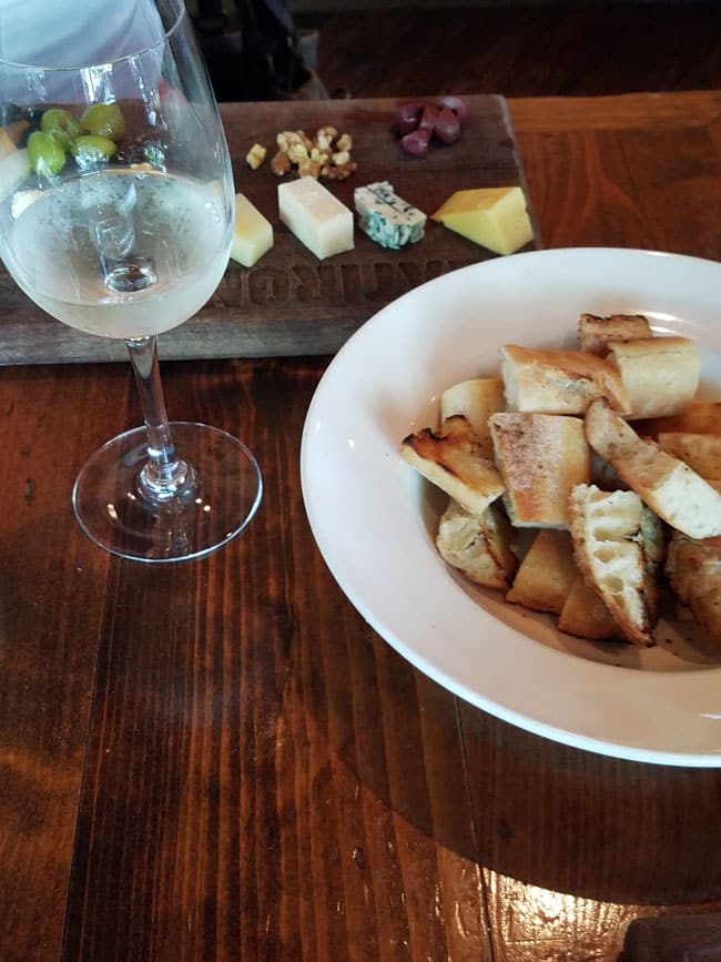 grilled bed and glass of water on table