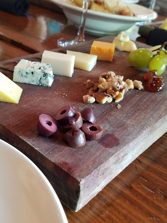 cheese, nuts, olives on board