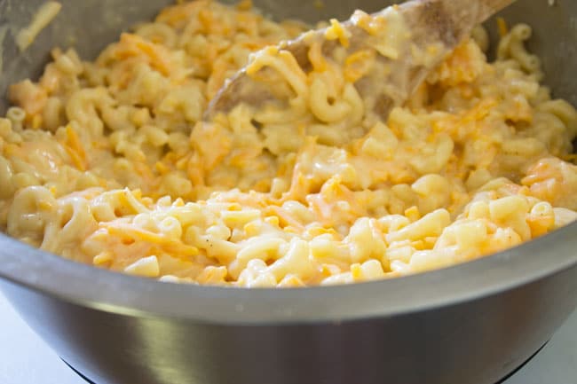 creamy baked macaroni and cheese in steel bowl