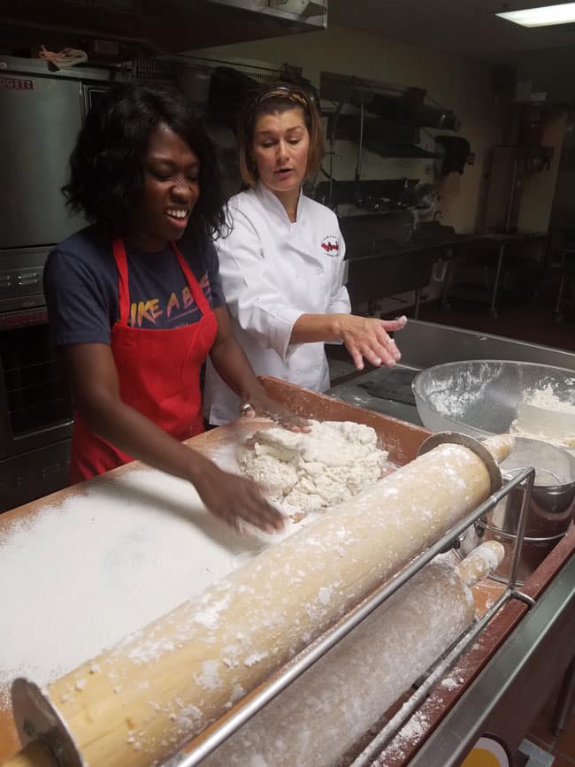 author making face when touching wet dough