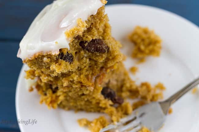 pumpkin cake half eaten with fork on plate 