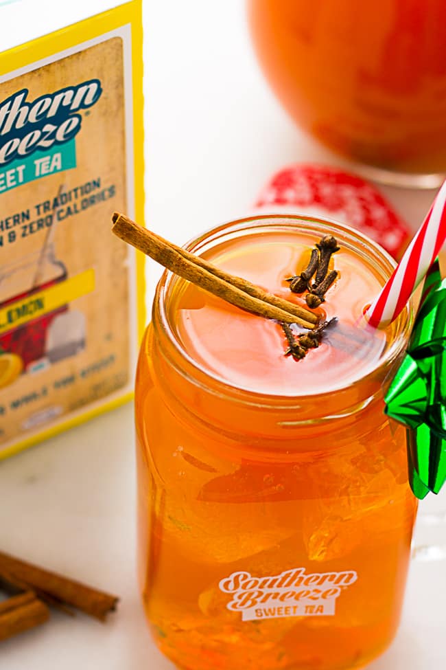 spiced sweet tea in glass with cloves on top