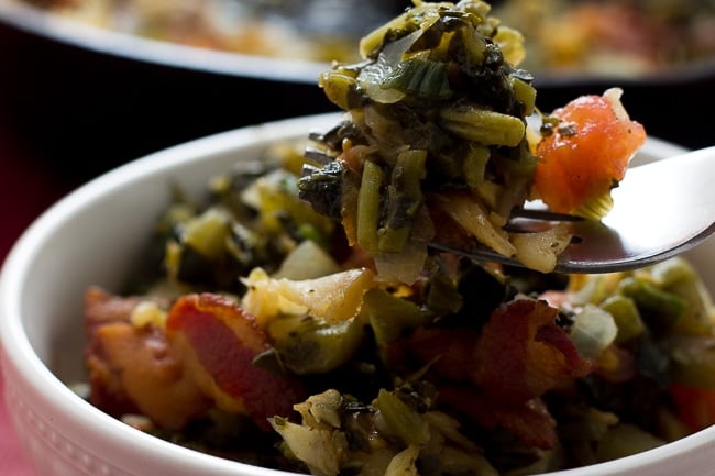 callaloo and saltfish on a fork