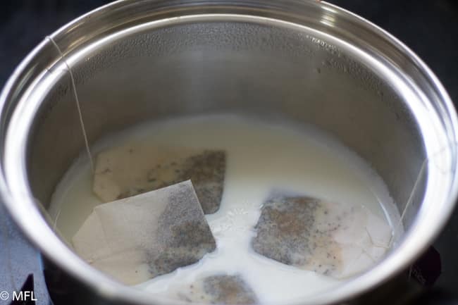 tea bags in liquid in saucepan