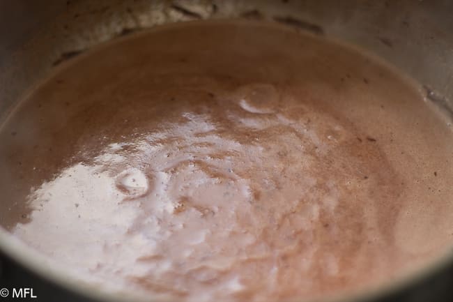 chocolate melted in cream in saucepan