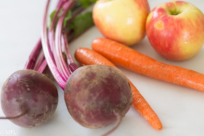 ingredients for beet juice on white counter