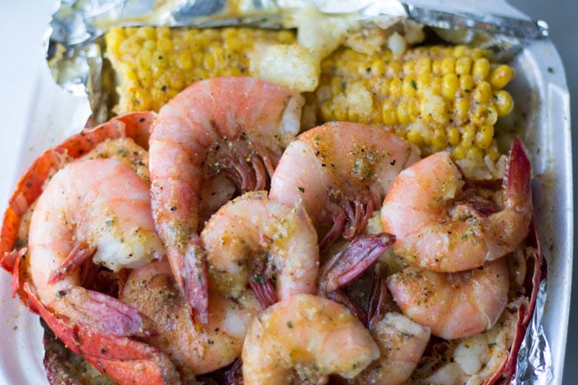 seafood shrimp, corn in container