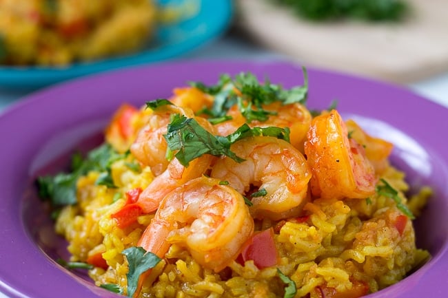 pressure cooker shrimp paella on a purple plate