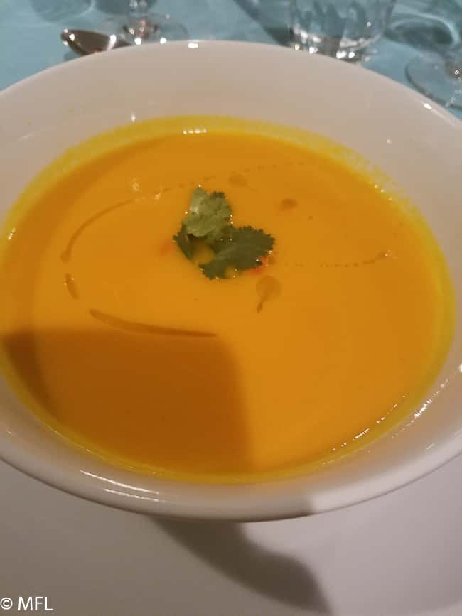 carrot ginger soup in white plate