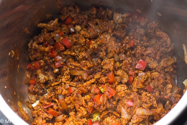 ground turkey in pot with seasonings