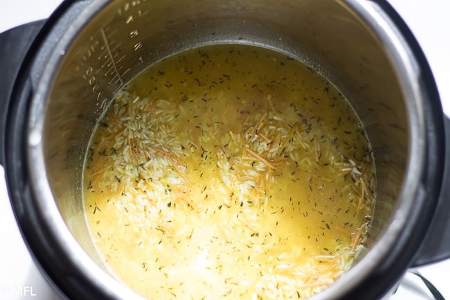 rice, spaghetti, and chicken broth and seasonings in insert