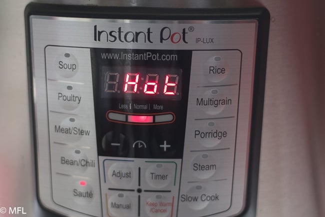 instant pot display with the word HOT on the screen