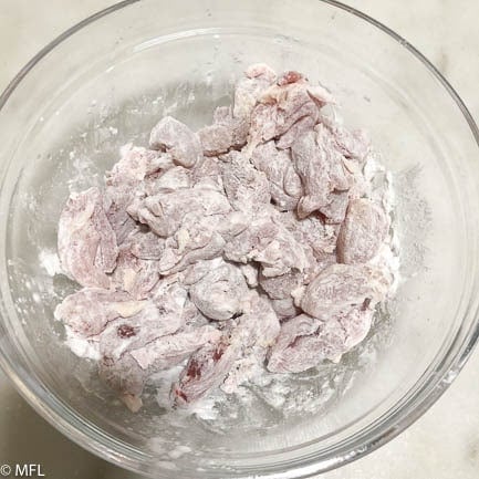 chicken pieces covered in cornstarch