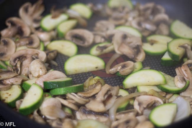 zucchini and mushrooms in skillet