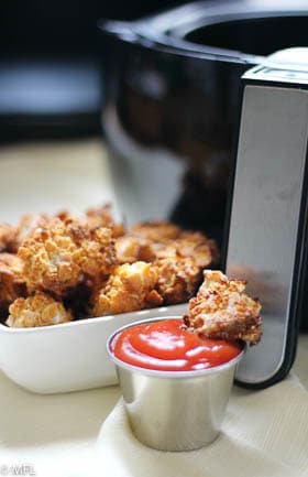 chicken nuggets in ketchup near air fryer