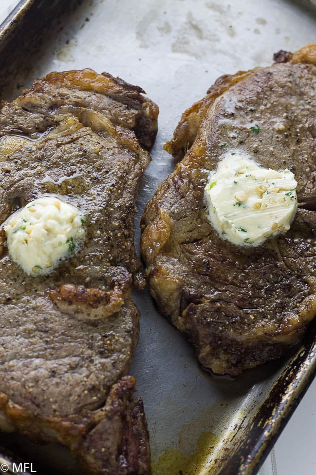 Perfect Air Fryer Steak with Garlic Herb Butter. Create the perfect steak in your air fryer. Tried and true method of creating juicy and delicious steak. #airfryerrecipes #airfryer #airfryersteak #ribeye #ribeyesteak #flavouredbutter #garlicherbbutter #delicioussteak @airfryerrecip