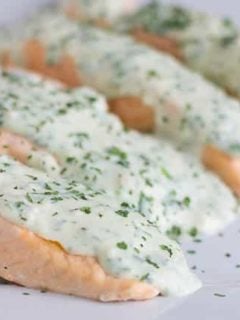 This 5 Minute Pressure Cooker Salmon is perfect for a quick meal in the Instant Pot. Top it with a creamy herb parmesan sauce for a quick and fancy meal. #instantpot #quickdinner #salmonrecipe #pressurecookersalmon #myforkinglife