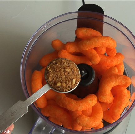cheese chips and seasoning over food processor