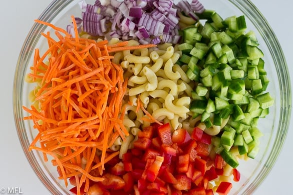 pasta and vegetables in glass bowl