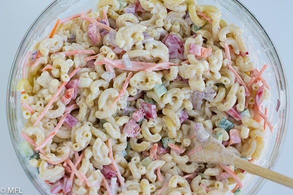 This Hawaiian Macaroni Salad is a sweet and tangy macaroni salad that is a twist on traditional macaroni salad. Covered in a delicious creamy sauce with bright vegetables, it's perfect for summer. #easy #hawaiian #sidedish #cookoutsides #mealprep #pastasalad #picnicsalad #summersalad #hawaiianmacaronisalad #myforkinglife