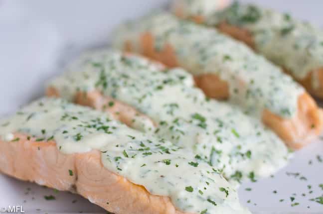 salmon with herb on top