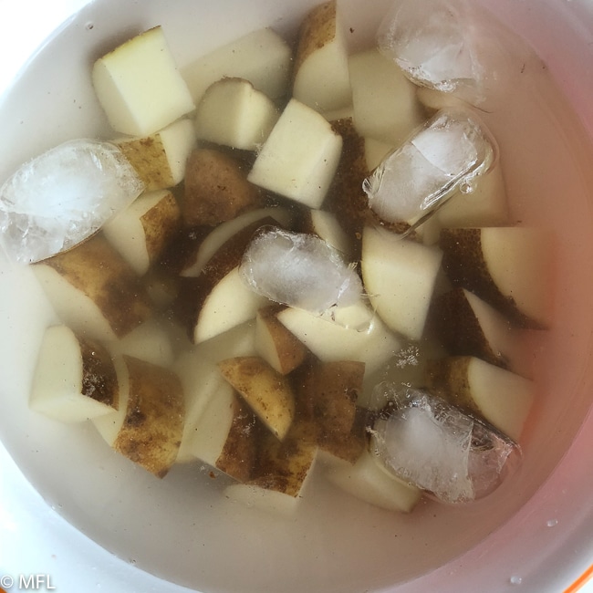 potato in ice water bowl