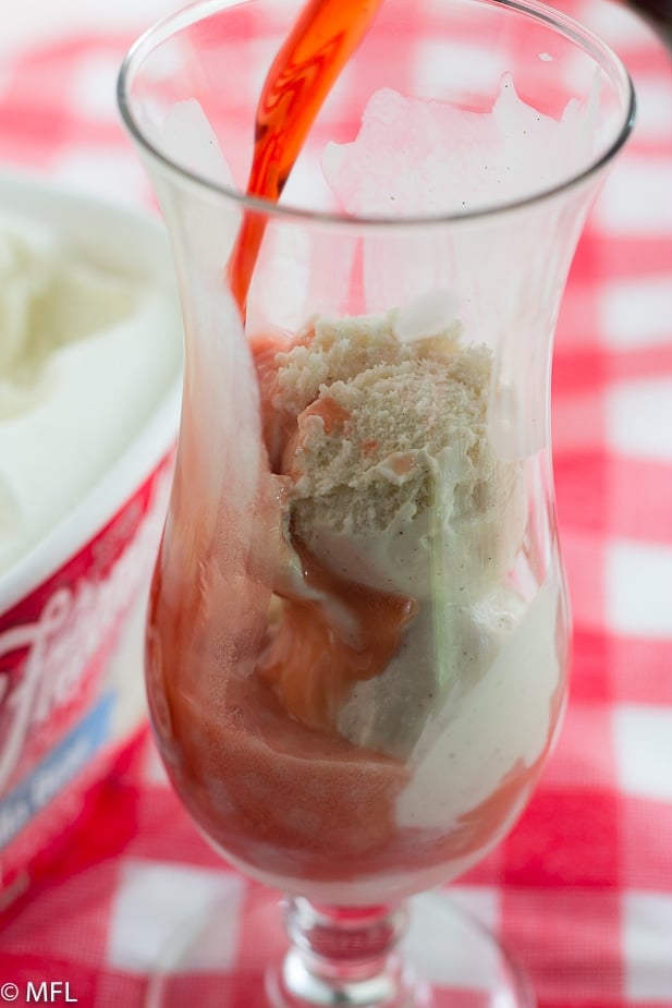 ice cream in glass with cola being poured into it