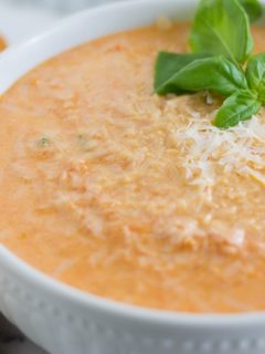 The Best Tomato and Basil Soup Recipe in a bowl, in a white plate.