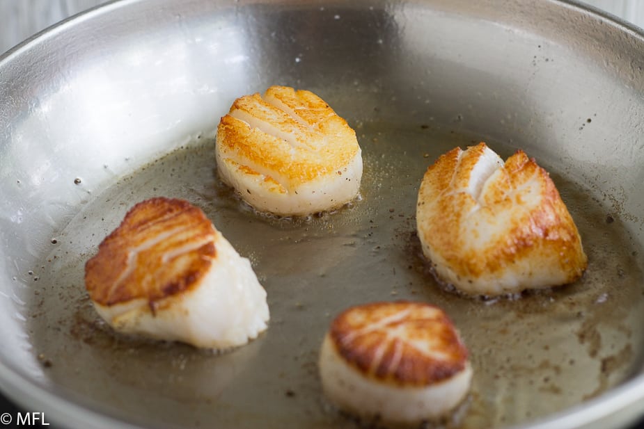 seared scallops in skillet