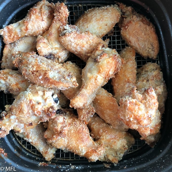 cooked chicken wings in air fryer basket