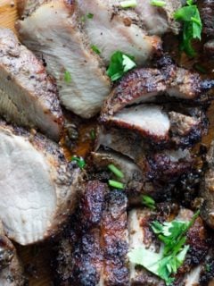 air fryer jamaican jerk pork recipe on a cutting board. This Air Fried Jamaican Jerk Pork Recipe is delicious and flavorful. Only 2 ingredients and easy to make for an easy weeknight dinner. Have a taste of the Caribbean with this tried and true method. #airfryer #airfryerrecipes #Jamaicanrecipes #Caribbeanrecipe