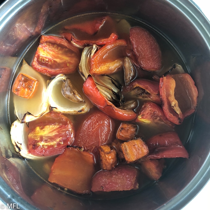 vegeatables in pot with chicken broth