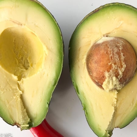 avocado cut in half. These Copycat Cheesecake Factory Avocado Rolls are made in the Air Fryer and have half the calories and fat than the restaurant version. They are healthy but have the same great taste and crunch. #airfried #airfryerrecipe #copycatrecipe #avocadorecipes #dippingsauce