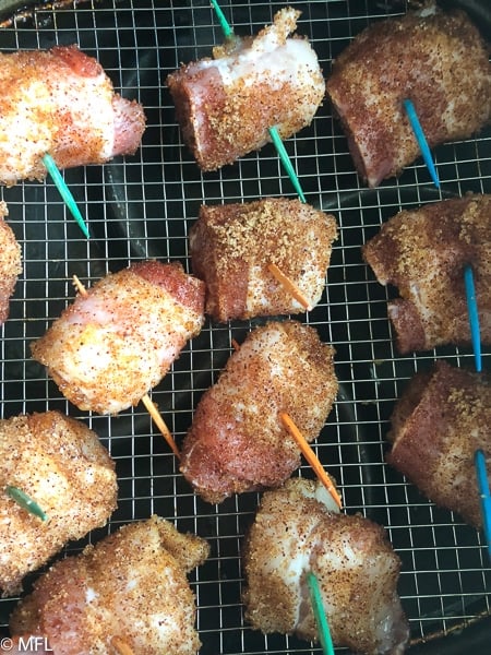 chicken wrapped in bacon in air fryer basket