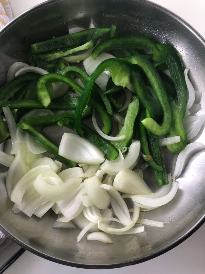 peppers and onions in a skillet