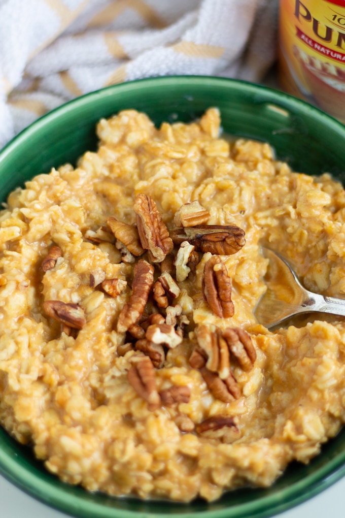 oatmeal in bowl with walnuts on top