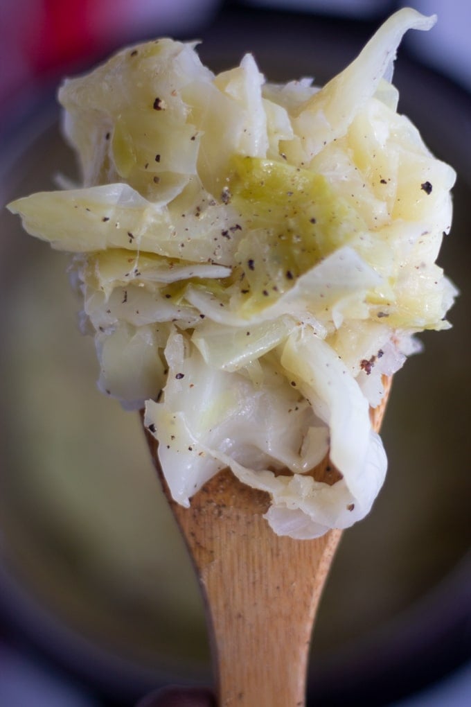This buttered Instant Pot Cabbage is easy and delicious and can be made right in your Instant Pot Pressure Cooker Multicooker. It’s one of our favorite ways to eat cabbage. #instantpot #instantpotpressurecooker #pressurecooker #vegetables #cabbagerecipe #instantpotsides instant pot cabbage on a spoon