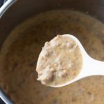 instant pot sausage gravy on a spoon