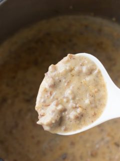 instant pot sausage gravy on a spoon