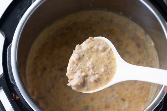 instant pot sausage gravy on a spoon