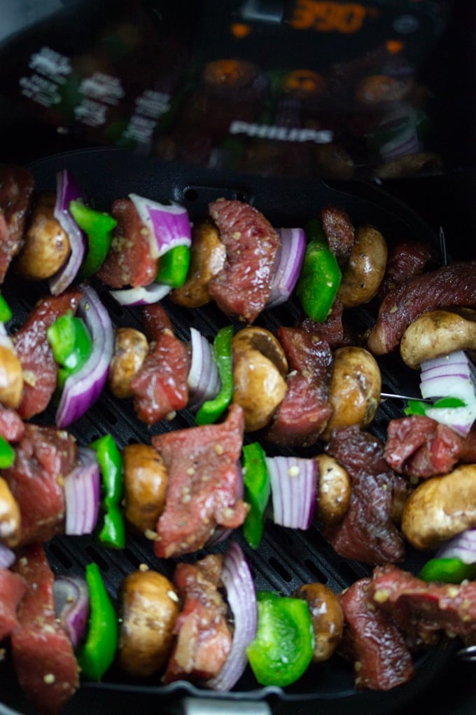 raw kebabs in air fryer basket