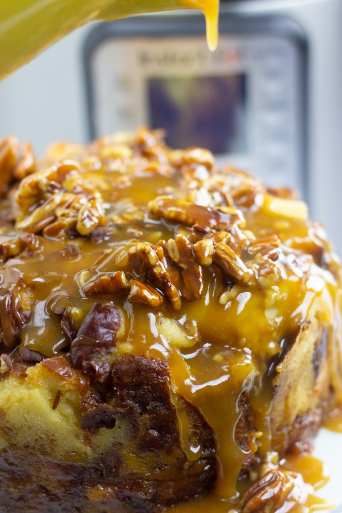 caramel glaze being poured over instant pot bread pudding