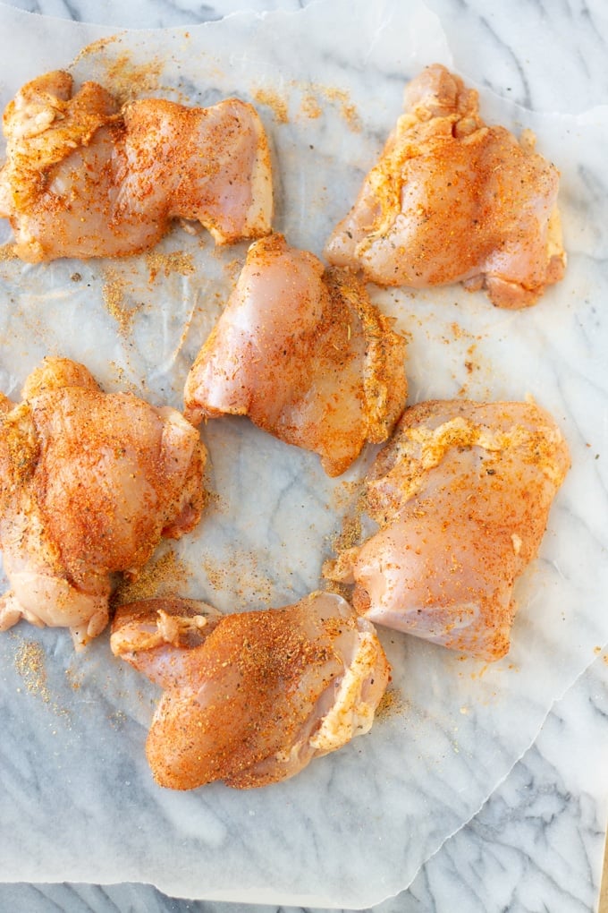 seasoned air fryer chicken thighs before placing in air fryer